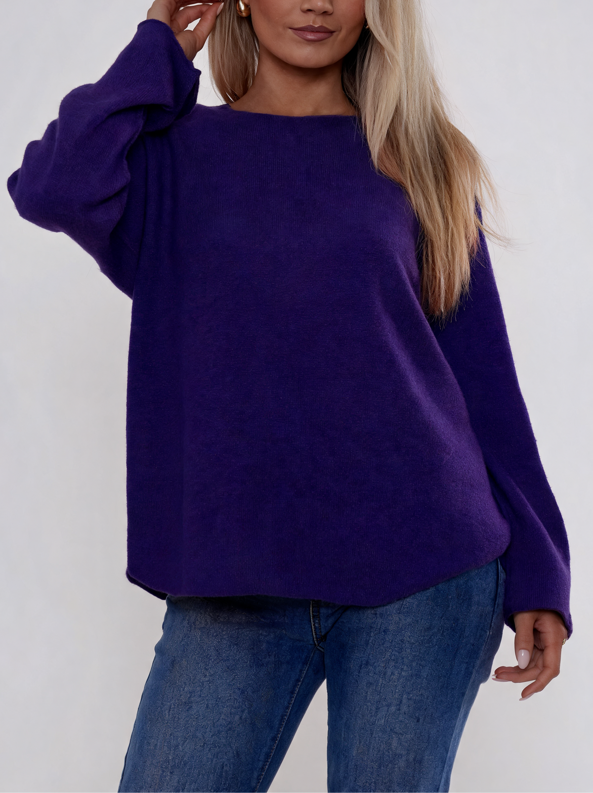 Deep purple soft knit boat-neck sweater with curved relaxed fit and long sleeves