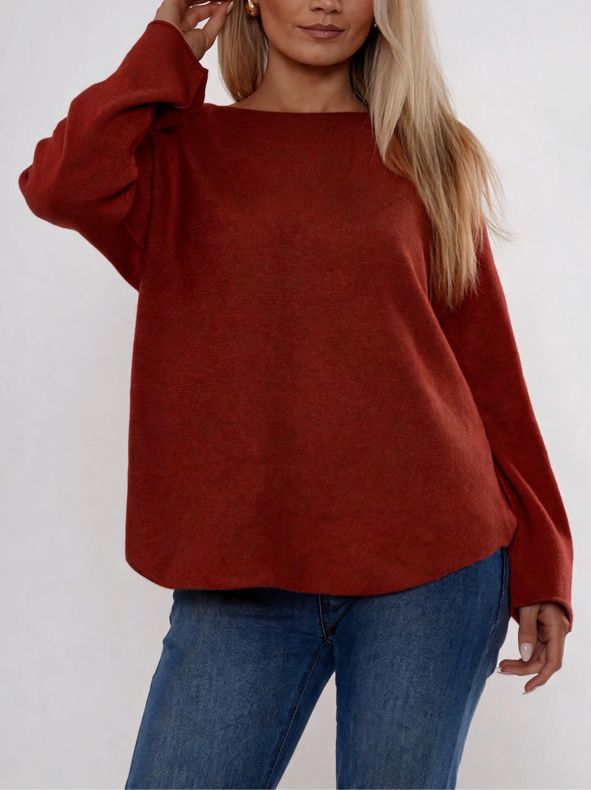Burgundy soft knit boat-neck sweater with curved relaxed fit and long sleeves