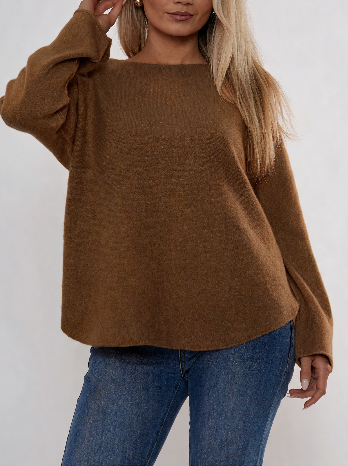 Brown soft knit boat-neck sweater with long sleeves and relaxed curved fit