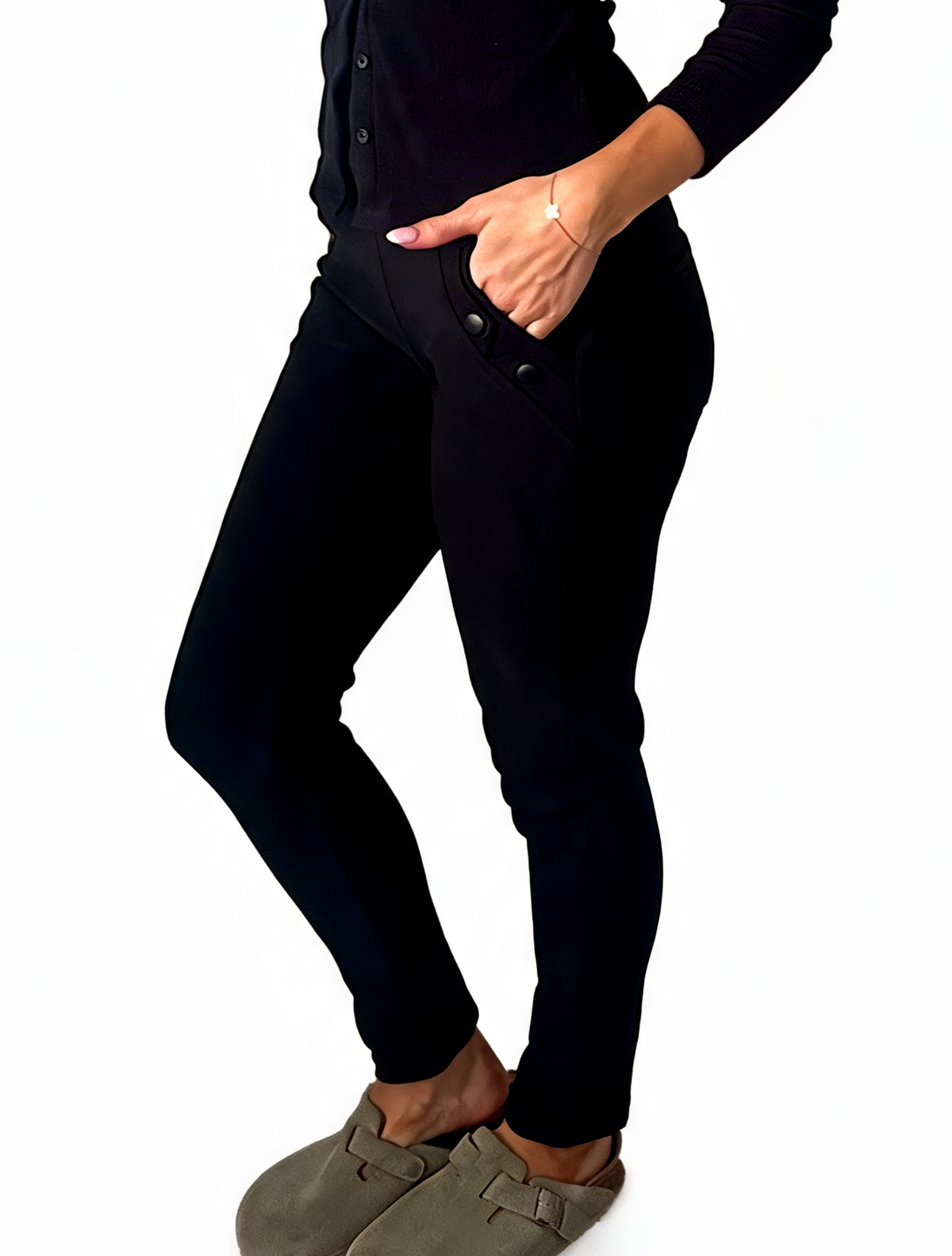 Black ankle-length leggings-style pants with side piping and zip pocket at hip