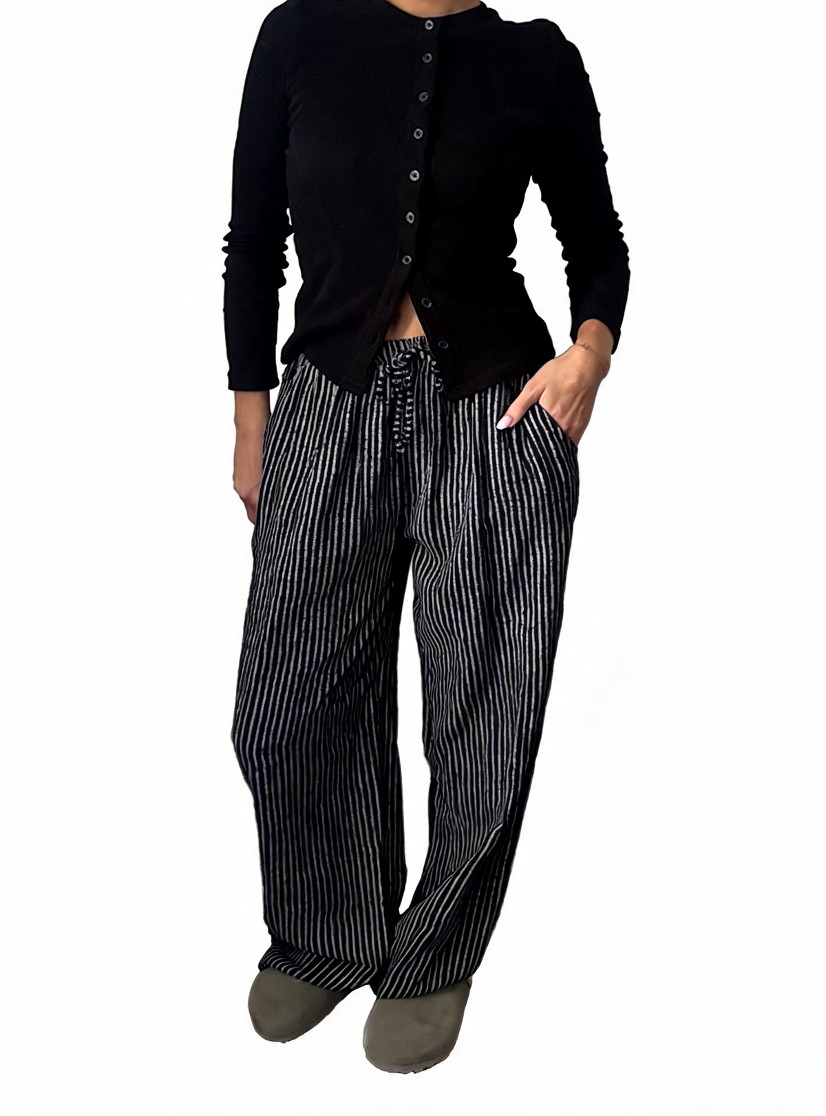 Black-and-white striped wide-leg drawstring trousers with tied waist cord