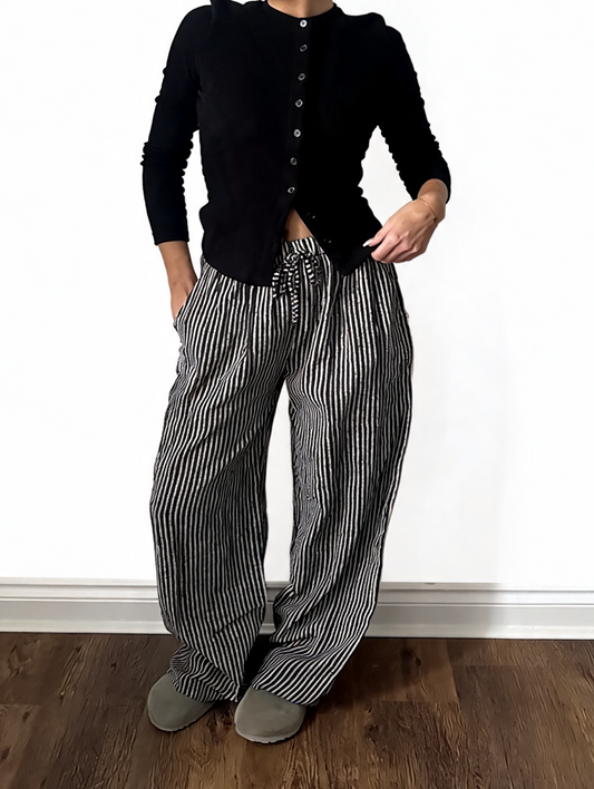 Black-and-white striped wide-leg drawstring trousers with elastic waist