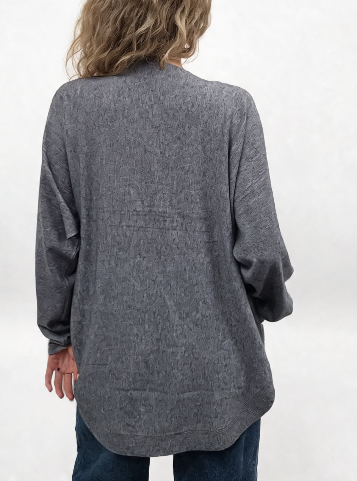 Grey oversized jumper with batwing sleeves, shown from the back