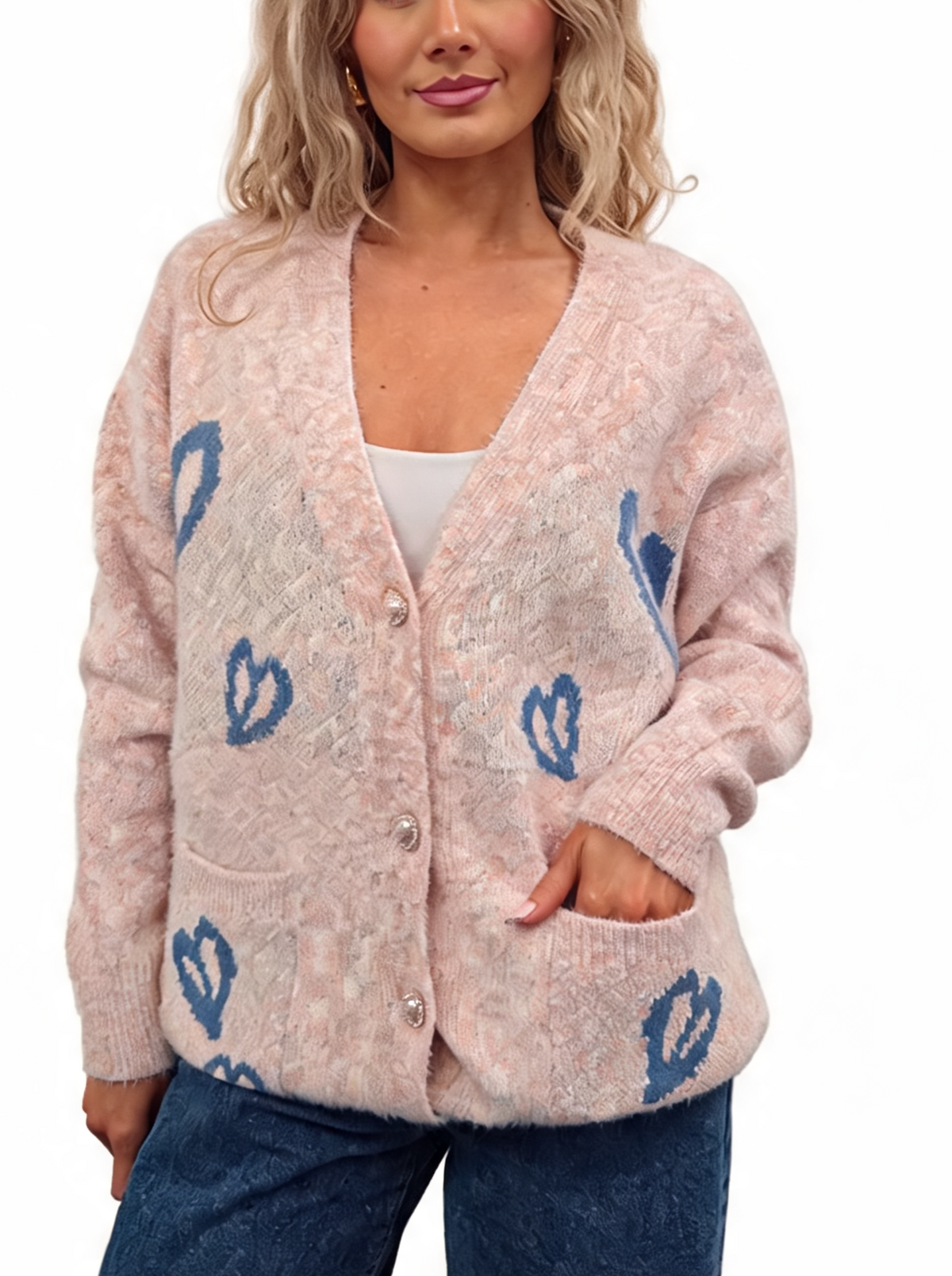 Pink fluffy knit oversized cardigan with V-neck, pearl buttons, and blue heart pattern