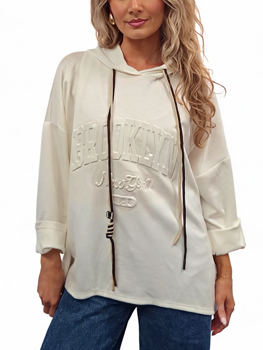 Oversized hooded sweatshirt in white with contrast drawstrings and embossed front logo
