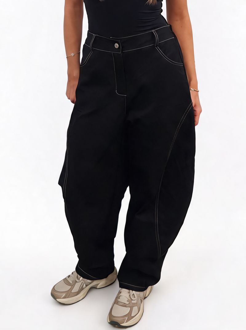 Black high-waisted baggy cotton twill pants with curved legs, contrast stitching and pockets