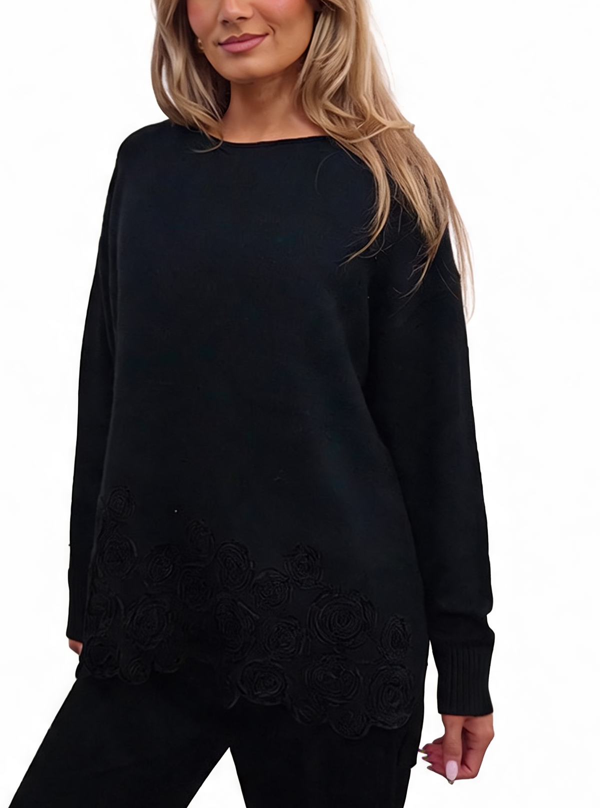 Oversized black chenille knit top with long sleeves and floral hem