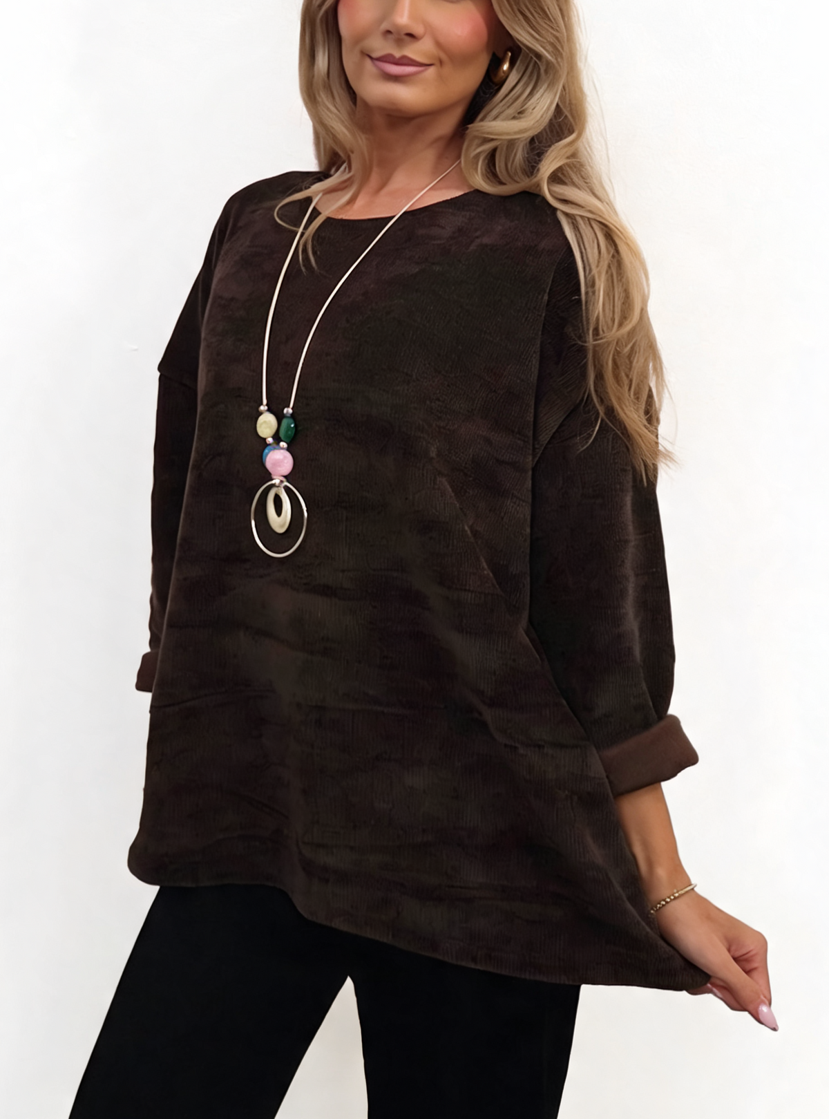 Oversized dark brown chenille knit top with necklace, front view and rolled cuffs