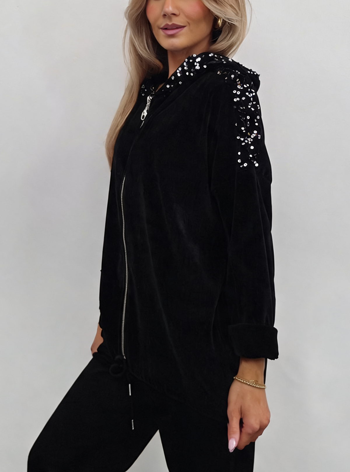 Black velvet hooded jacket with sequin-trimmed shoulders and front zipper