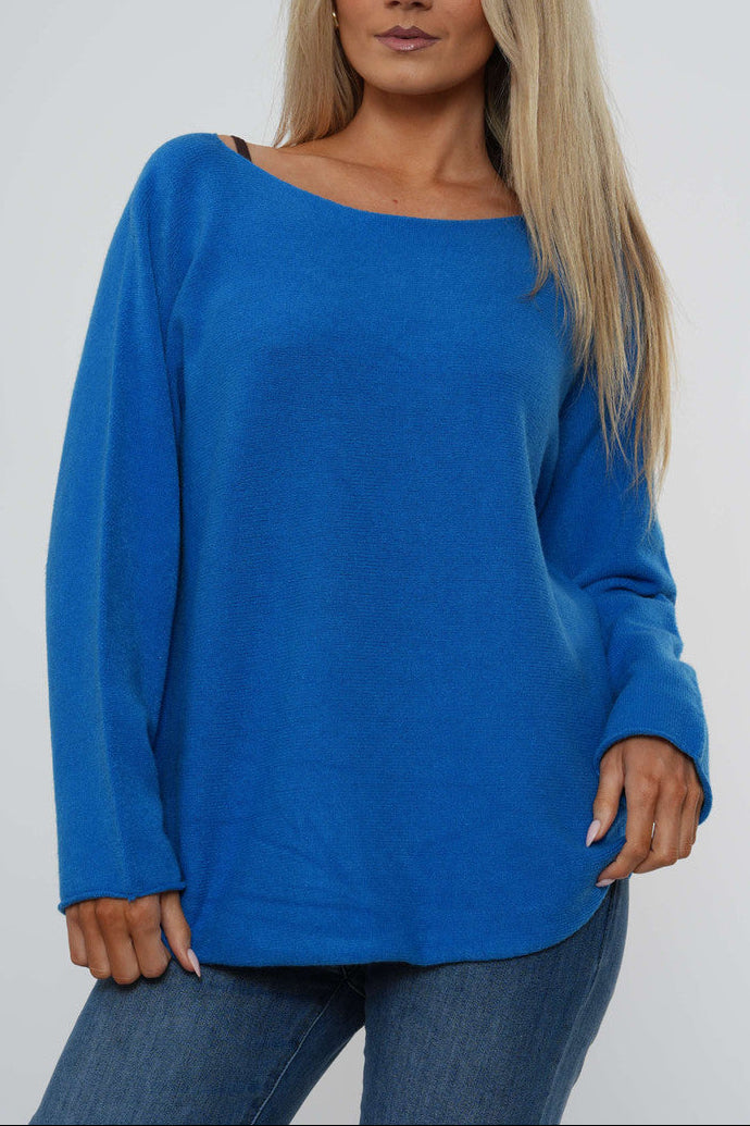 Royal blue boat neck knit sweater with long sleeves and relaxed curved hem