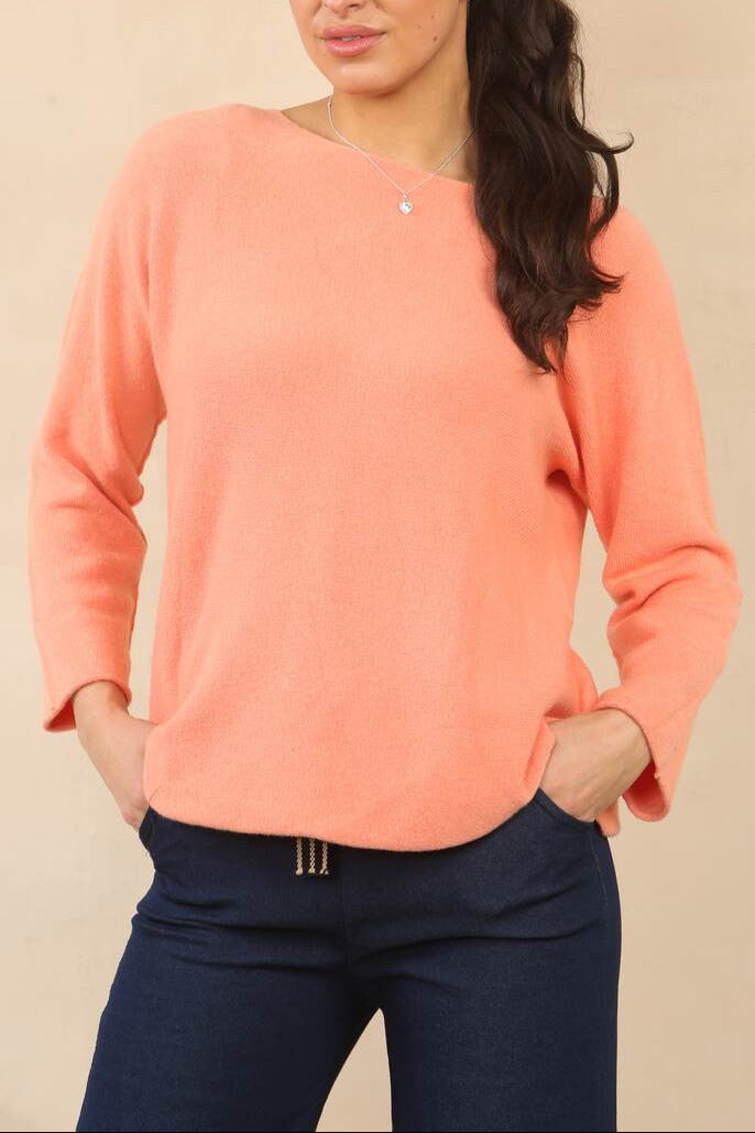 Coral soft knit boat-neck sweater with long sleeves and relaxed curved fit