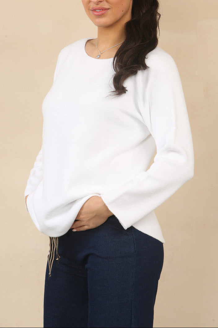 White soft knit boat-neck sweater with long sleeves and relaxed curved fit